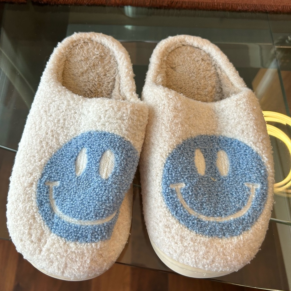 Smiley face slippers . New